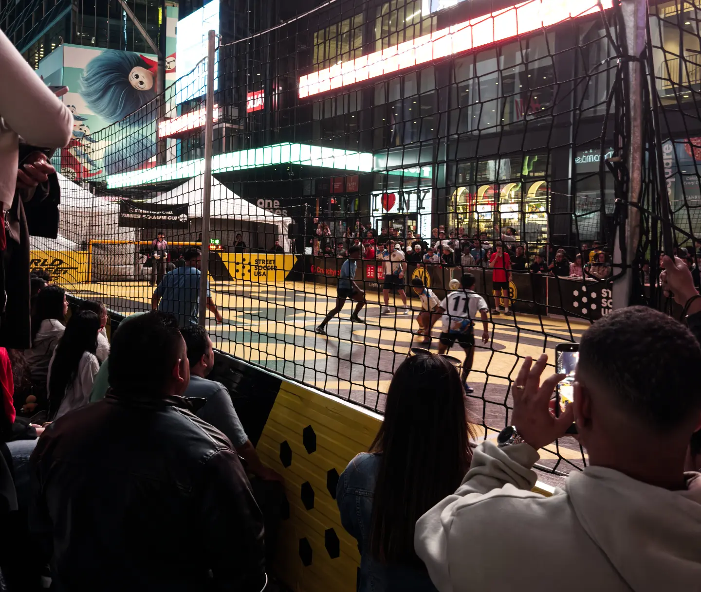 Evening game at the Times Square Cup 2026 under the neon signs of Times Square