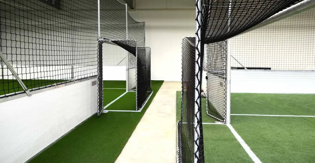 Goals with ball-stop nets on two neighbouring SoccerGround Indoor fields